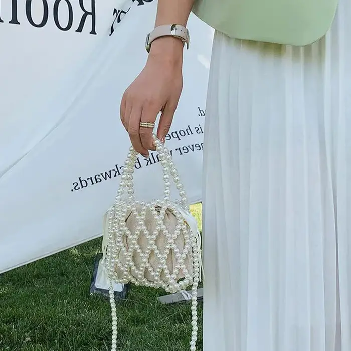 Sac à main rétro français fée populaire tissé perlé sac seau sac à bandoulière été Niche Design évidé