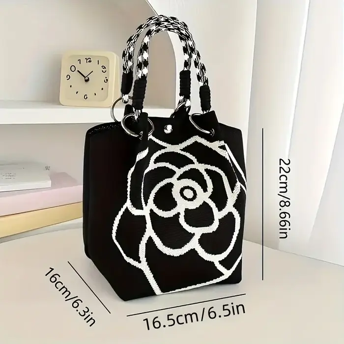 Sac à main tricoté à motif de fleurs noir et blanc