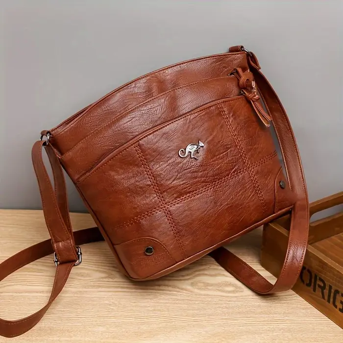 Sac bandoulière en cuir de style vintage avec compartiments multi-couches, large sangle réglable et 