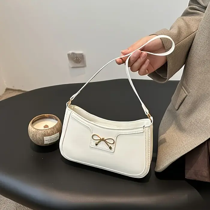 Sac à bandoulière à nœud papillon de couleur unie