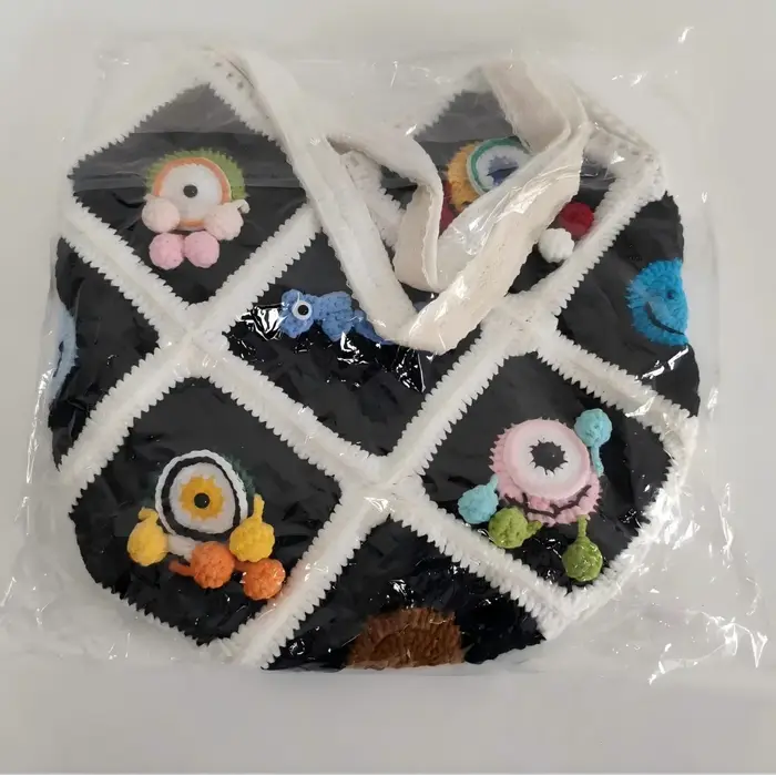 Sac à bandoulière en Crochet fait à la main avec fleur de monstre aux grands yeux