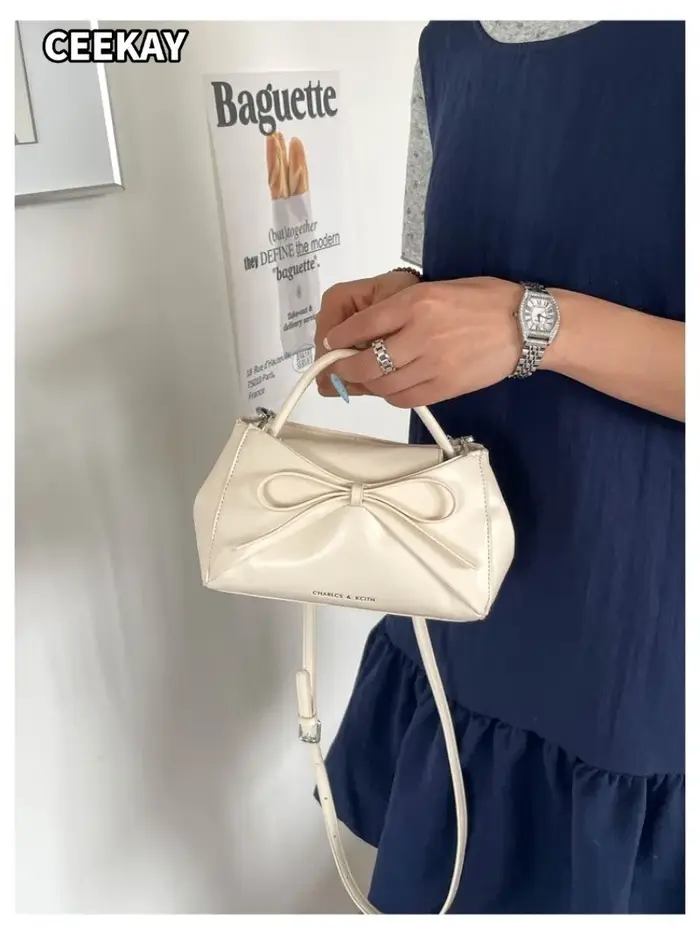 Sac à main mini trapèze élégant en PU souple avec grand nœud décoratif